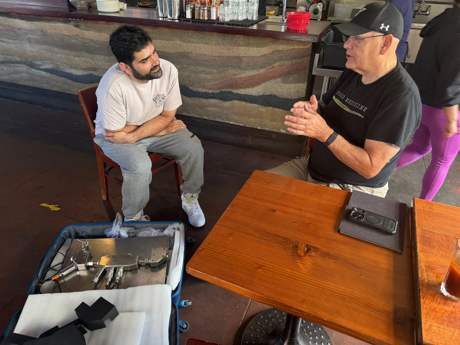 Gaurav Dhir in conversation during his Yotta visit, with cooling hardware in the foreground.